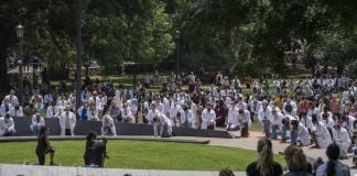 UVA medical students gathered at the Memorial to Enslaved Laborers and took a knee for nine minutes on June 5, 2020 (photograph by Sanjay Suchak / UVA Communications)