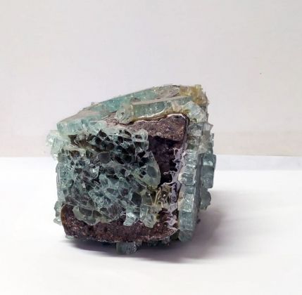 Giulio Delvè, Azione meccanica di una roccia effusiva su un solido amorfo, 2012, sanpietrino, vetro temperato, 15 x 15 x 12 cm. Courtesy the artist