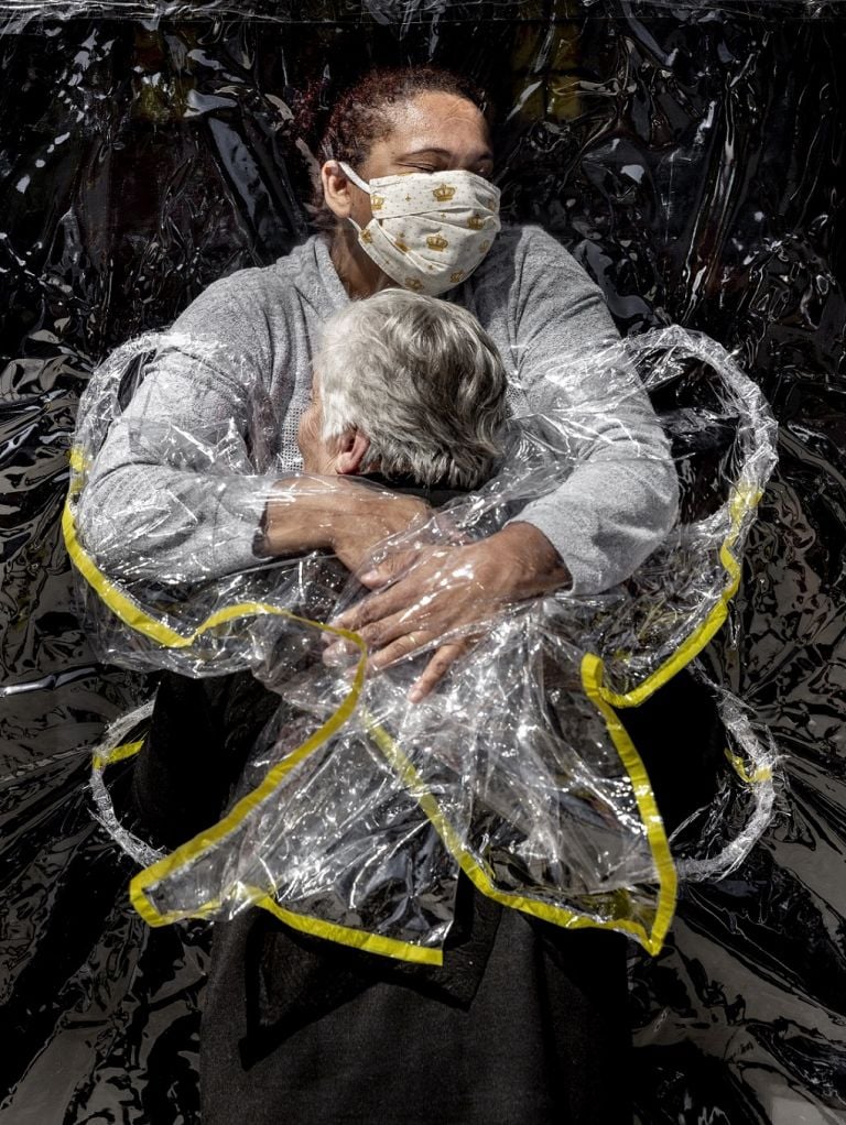 The First Embrace © Mads Nissen, Denmark, Politiken/Panos Pictures. 85-year-old Rosa Luzia Lunardi is embraced by nurse Adriana Silva da Costa Souza. The first hug she receives in five months.