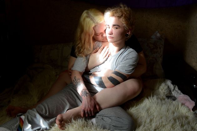 The Transition: Ignat © Oleg Ponomarev, Russia. Ignat, a transgender man, sits with his girlfriend Maria in Saint Petersburg, Russia, on 23 April 2020