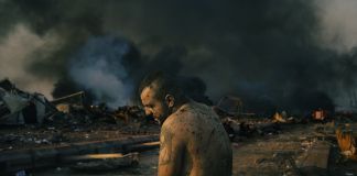 Injured Man After Port Explosion in Beirut © Lorenzo Tugnoli, Italy, Contrasto for The Washington Post BEIRUT, LEBANON - AUGUST 4: An injured man stands inside the wrecked site of the port of Beirut while firefighters work to put out the fires that engulfed the warehouses after the explosion. (Photo by Lorenzo Tugnoli/ Contrasto for The Washington Post)