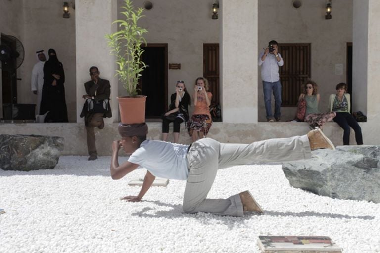 Otobong Nkanga, Taste of a Stone. Itiat Esa Ufok, 2013. Performance view at Sharjah Biennial 11, Sharjah Art Foundation, 2013. Commissioned by Sharjah Art Foundation