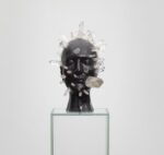 Marina Abramovic, The Communicator, 2012, cera nera con pietre di quarzo, piedistallo di vetro, 60x60x60 cm, piedistallo 130x24x24 cm