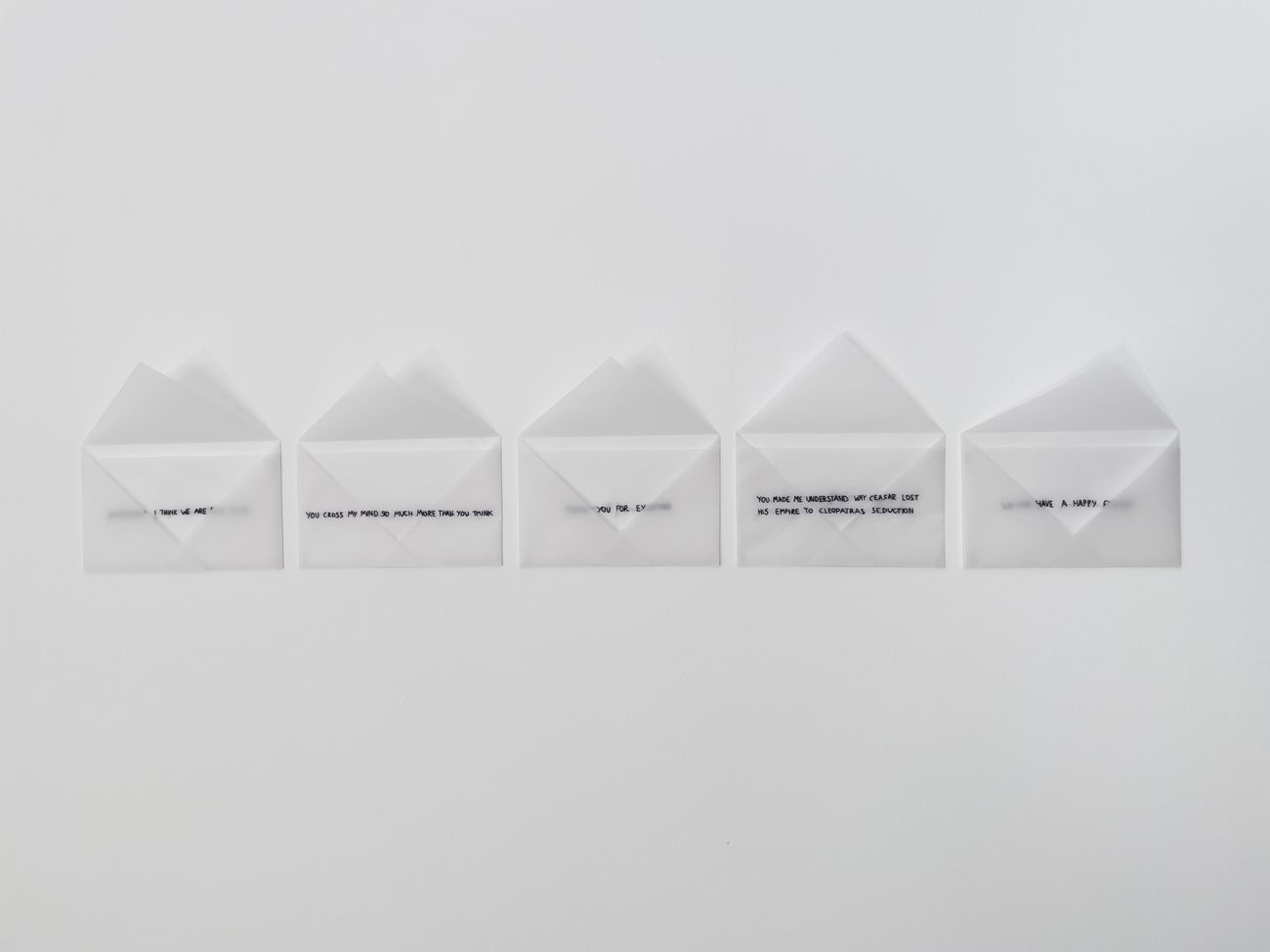 Terentis Antoniou, Unsent love letters, 2020, serie da 5, installazione, carta lucido e inchiostro nero, 12 x 18 cm