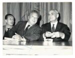 Alberto Moravia, Caro Levi e Renato Guttuso seduti affiancati in occasione della manifestazione al teatro Brancaccio per solidarietà a Cuba, Roma 1962-63