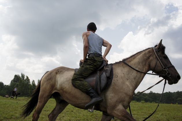 Students train horse-back riding at the Historical-War Camp, in Borodino, Russia. 28 July 2016. Borodino is famous for a battle fought on 7 Sep 1812 - the deadliest day of the Napoleonic Wars. 350 adolescents are in attendance, ranging in ages from 11 to 17, and lasts throughout the summer.
