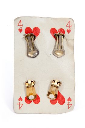 Erik Kessels & Thomas Mailaender, Europe Archive, 2021. Four ff Hearts Playing Card Holding Four Clip On Earrings