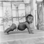 James Barnor, Baby on All Fours, Eric Nii Addoquaye Ankhra, Ever Young Studio, Accra, 1952 ca., Modern Silver Gelatin Print © James Barnor. Courtesy galerie Clémentine de la Féronnière, Paris