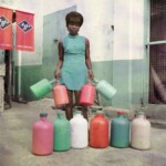 James Barnor, Sick-Hagemeyer shop assistant with bottles, taken as a colour guide, Accra, 1971, C-Type print © James Barnor – Autograph ABP, London