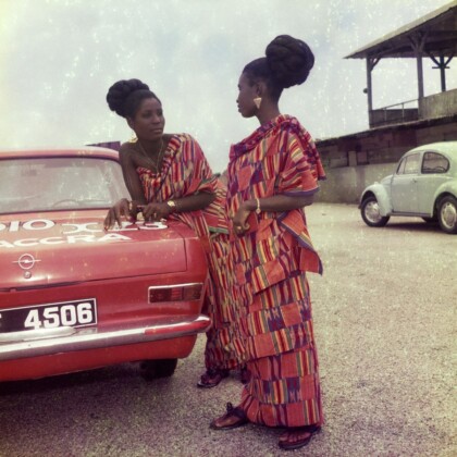 James Barnor, Two friends dressed for a church celebration with James’ car, Accra, anni '70, Modern Silver Gelatin Print © James Barnor – Autograph ABP, London