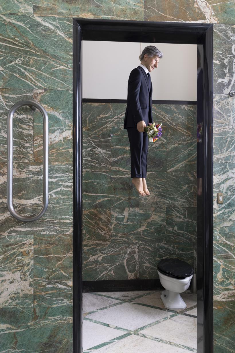MAURIZIO CATTELAN YOU, 2021 PLATINUM SILICONE, EPOXY FIBERGLASS, STAINLESS STEEL, REAL HAIR, CLOTHES, HEMP ROPE AND FLOWERS 140 × 40 × 25 CM : 55 × 15 3:4 × 10 INCHES