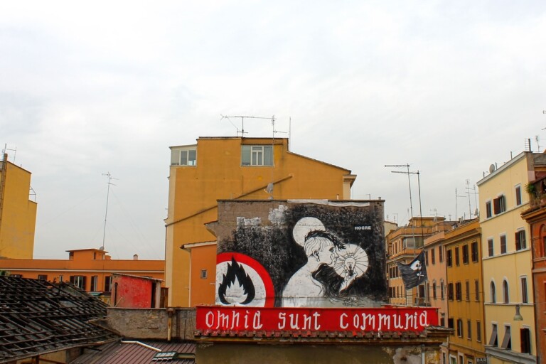 Hogre, Omnia Sunt Communia, 2013, subvertising intervention, San Lorenzo, Rome. Photo credits Hogre