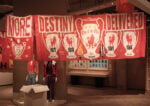 Installation photography featuring Destiny Delivered banner by Peter Carney and Carmel Gittens, 2005—2007. Felix Speller
