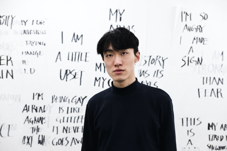 Isaac Chong Wai at ACUD Macht Neu in front of an installation of his work Rehearsal of the Futures: Is the World Your Friend? Photo Tobias König