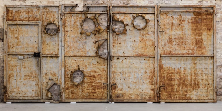 Ai Weiwei, A Metal Door with Bullet Holes, 2015, Metal, Courtesy of the artist, Photo_ Courtesy Ai Weiwei Studio © 2022 Ai Weiwei