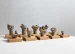 Ai Weiwei, Feet (Buddha), 2003, Stone, wooden plinths, wooden table, Private Collection, Photo_ The ALBERTINA Museum, Vienna _ Lisa Rastl & Reiner Riedler © 2022 Ai Weiwei