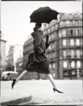 Richard Avedon, Carmen (homage to Munkácsi), coat by Cardin, Place François Premier, Paris, August 1957 © The Richard Avedon Foundation