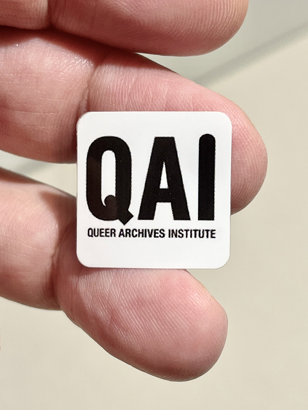 A QAI sticker, logotype designed by Fontarte, produced by Centrala, Birmingham, 2016, donated – United Kingdom