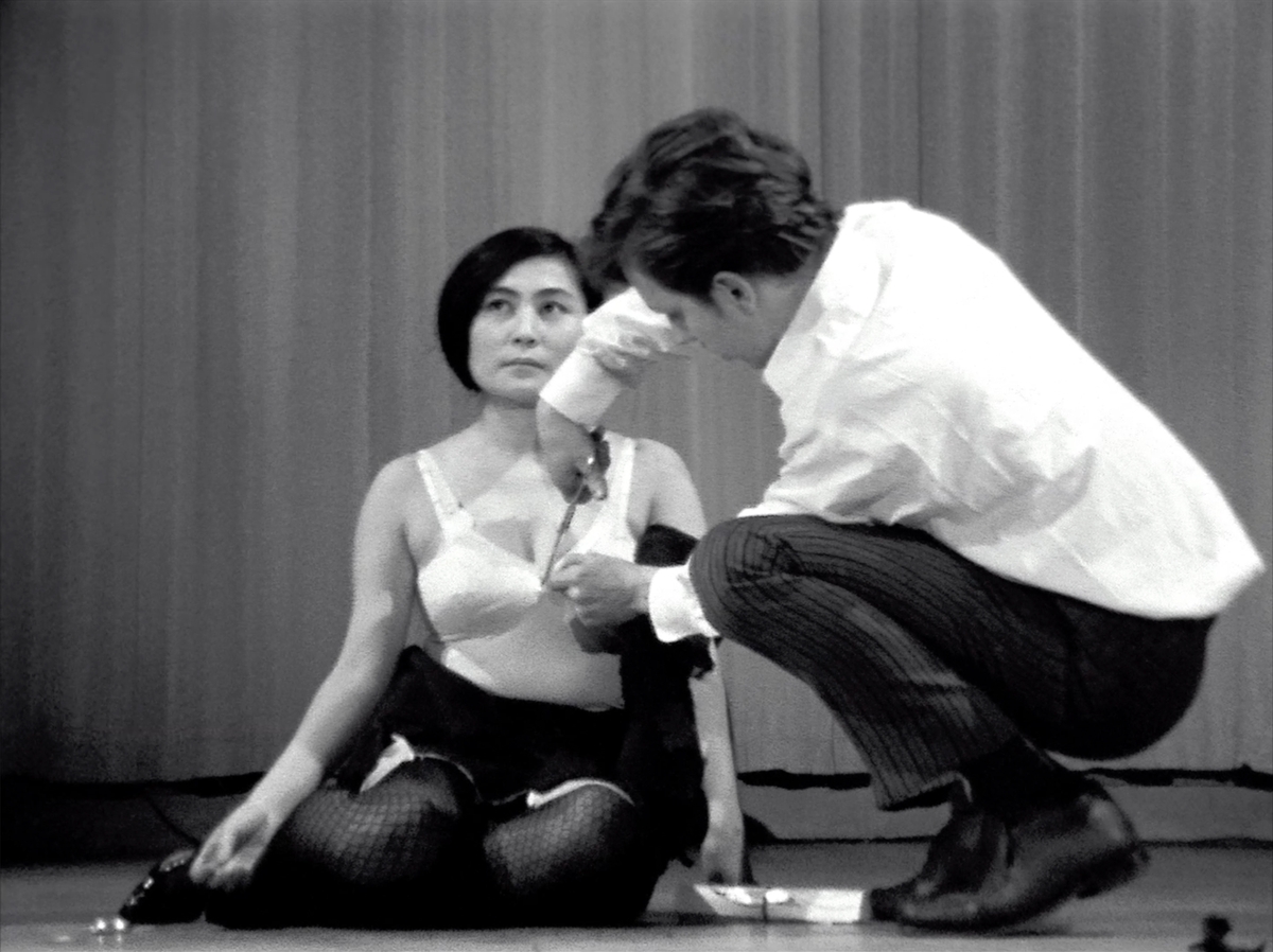 Yoko Ono, Cut Piece, 1964-1965. Performed by the artist as part of New Works of Yoko Ono. Carnegie Recital Hall, New York City, March 21, 1965 © Yoko Ono. Courtesy of Yoko Ono