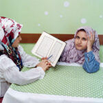 Sabiha Çimen, Hatice, 9, tries to recite Quran passages by memory to her classmate. Istanbul, Turkey, 2021 © Sabiha ÇimenMagnum Photos