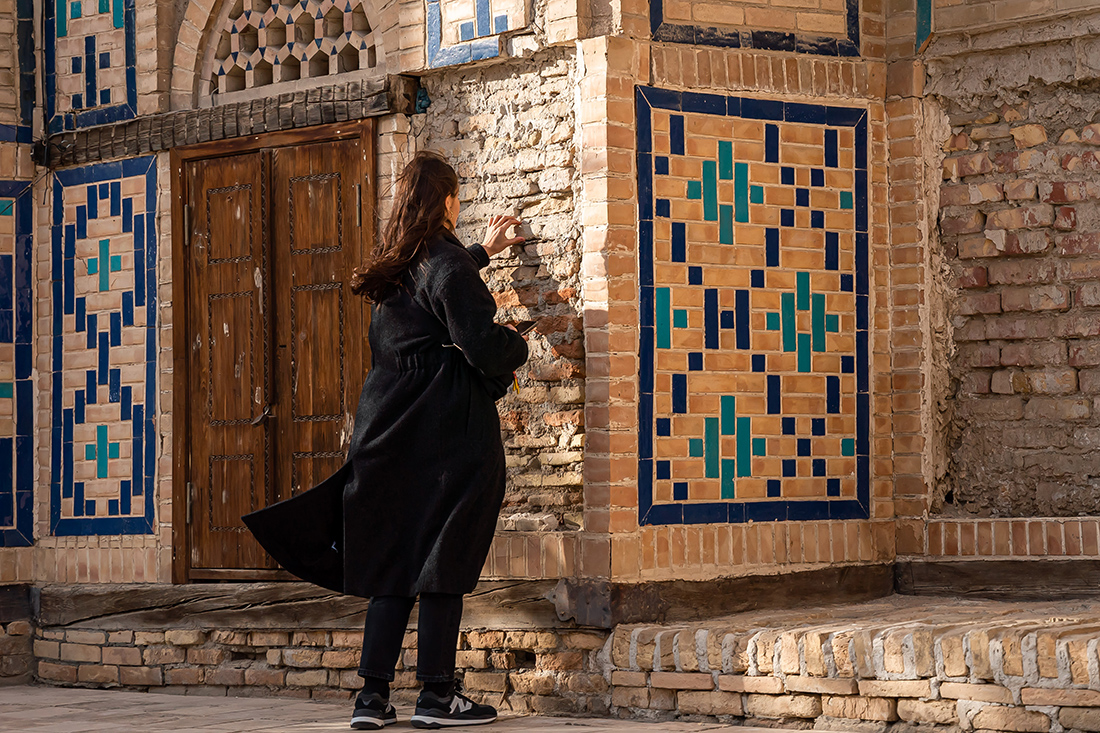 Curator Sophia Bengebara in Khiva. The ancient bricks of Khiva. Image courtesy of ACDF, photo Vyacheslav Pak