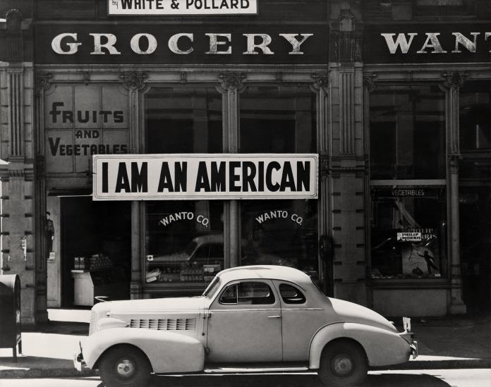 Dorothea Lange, A large sign reading I am an American, 1942, The New York Public Library, Library of Congress, Prints and Photographs: Division Washington