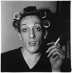 A young man in curlers at home on West 20th Street, N.Y.C. 1966 © The Estate of Diane Arbus Collection Maja Hoffmann / LUMA Foundation
