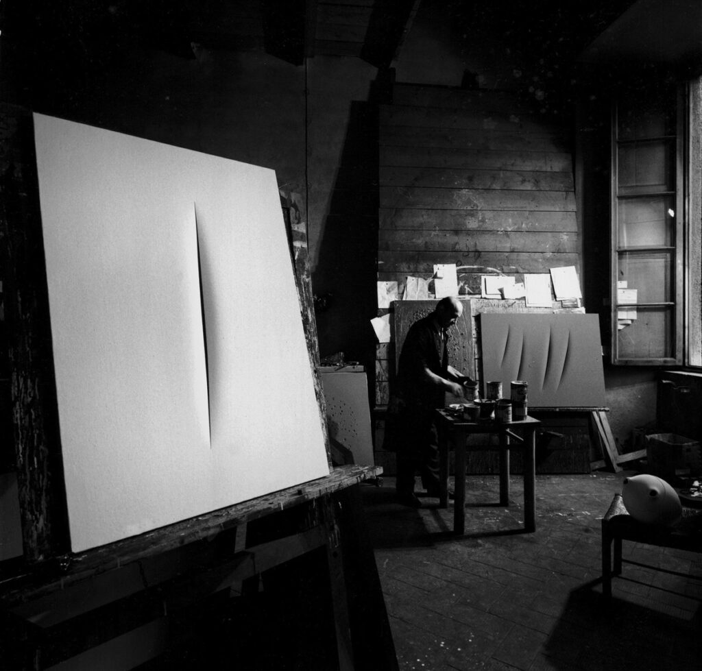 Lucio Fontana nel suo studio di Corso Monforte, Milano, 1962 by Ugo Mulas