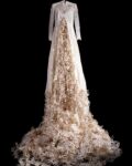 Andi Arnovitz, What We Bring, 2023, Artist’s own wedding dress, laser cut names on bookbinding fabric. Hand sewing. Photo: Yair Medina
