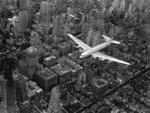 Aerial view of a DC-4 passenger plane flying over midtown Manhattan, New York City, New York, 1939 © Margaret Bourke-White/The LIFE Picture Collection/Shutterstock
