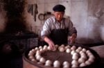 Eve Arnold, Making steamed bread, China, 1979 © Eve Arnold, Magnum Photos
