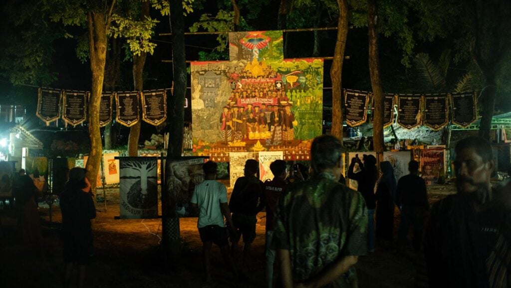 Installation of Kendeng Lestari, Nyawiji Kanggo Ibu Bumi banner, ronteks and pennants, from People’s Justice series No. 5, 2023, in Sonokeling, Misik village, Sukolilo, Pati, Central Java, December 2025
