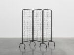 Mona Hatoum work title Divide 2025 Mona Hatoum, Divide, 2025 three panel steel screen and barbed wire 172 x 188 x 48 cm &copy; Mona Hatoum. Photo &copy; White Cube (Theo Christelis). &copy; Mon
