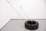 Simone Marconi, B-Aratro, 2024, pneumatico, legno, plastilina, corda, gancio, 130 x 135 x 120 cm
