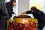 Samboleap Tol, Dharma Songs, 2023. Interactive sound system, iron gong, teak table, Arduino, speaker electrical wires, banana leaves, artificial flowers, fresh flowers, water, 120 cm x 90 cm x 90 cm The Spirits of Maritime Crossing 2026. Bangkok Art Biennale Foundation Palazzo Rocca Contarini Corf&ugrave;