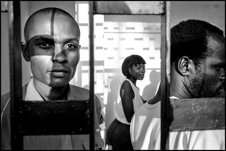 Bruce Gilden, HAITI. Port-au-Prince. 1990. Soccer stadium, early evening.