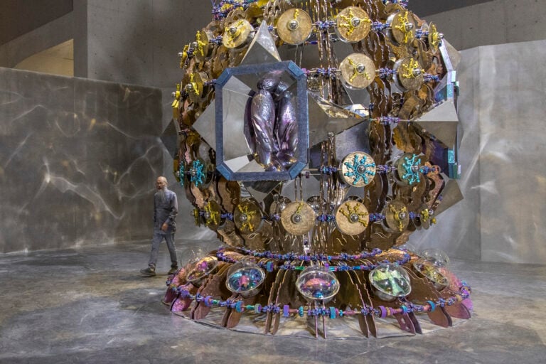 Wallace Chan standing by 7 metre Vessels of Other Worlds, Birth. Photo JJYPHOTO