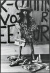 Yayoi Kusama poses in 'Untitled (Dress)' with her phallic sculptures in her New York studio, 1971. Photo: Tom Haar. &copy; YAYOI KUSAMA