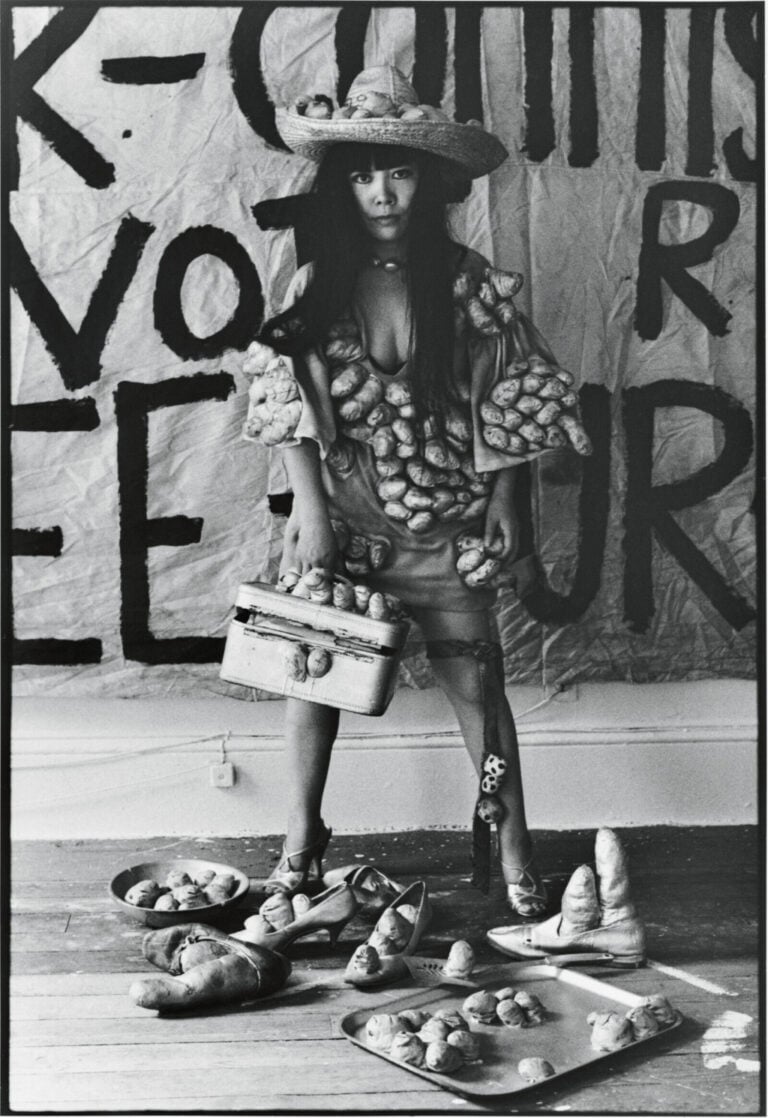 Yayoi Kusama poses in 'Untitled (Dress)' with her phallic sculptures in her New York studio, 1971. Photo: Tom Haar. &copy; YAYOI KUSAMA