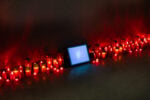 Bruna Esposito, Oltremare (sotto terra vulnerabili), 2006-2011. Video in loop con audio, monitor, sacchetti di riso, lumini da cimitero, rame, seta. Courtesy of Wizard Gallery, Milano. Photograph by Marco Anelli and Tommaso Sacconi. Photo courtesy of Magazzino Italian Art