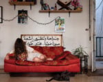 Rania Matar, Maya (Odalisque with Cat), Beirut, Lebanon, 2024 (The sign says Surgery, Endoscopy, X-ray, Ultrasound, Lab, Emergency) (Courtesy of the Artist)